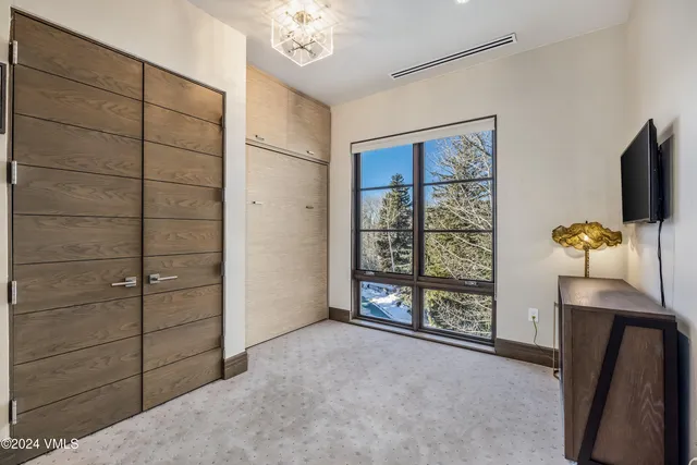 a bathroom with a granite countertop sink toilet a mirror and shower