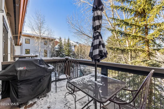 a view of a building with sitting area