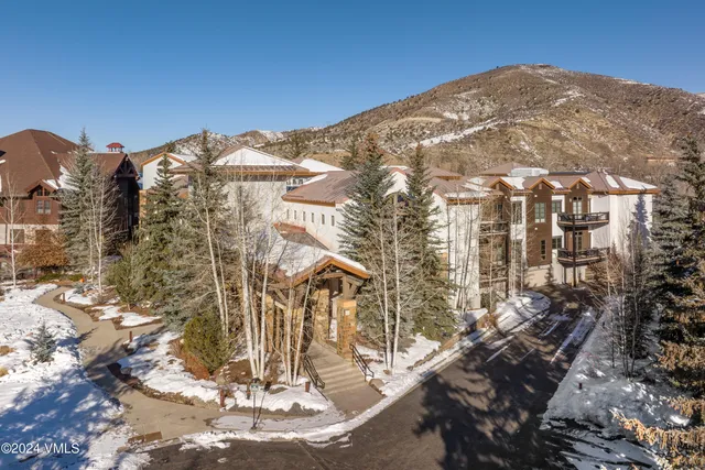 a view of a city with mountains in the background