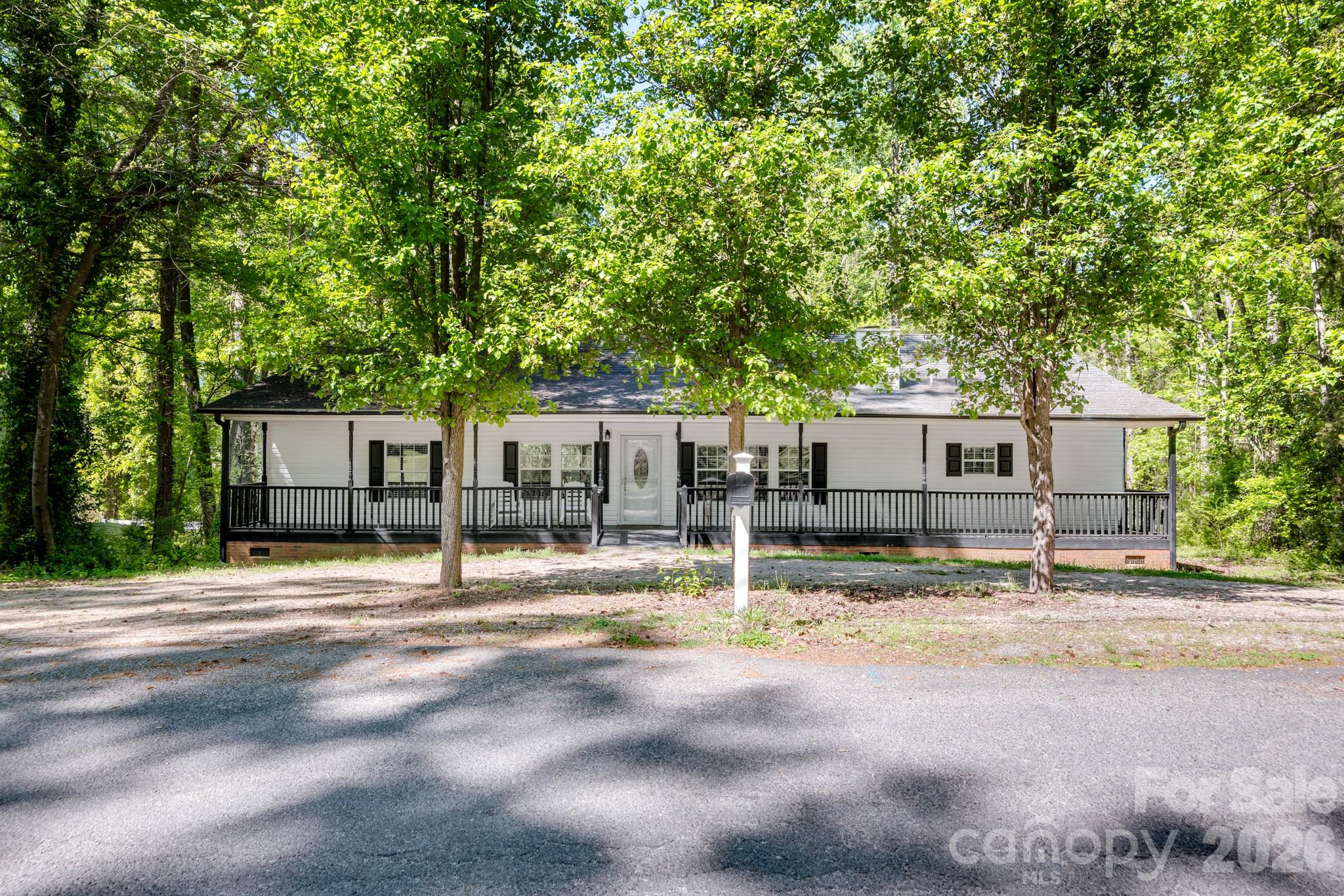 116 Springdale Drive York, SC 29745 - Photo 1 of 32 a house with trees in the background