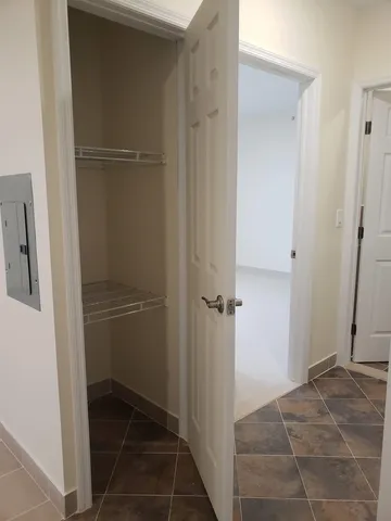 a kitchen with refrigerator and window