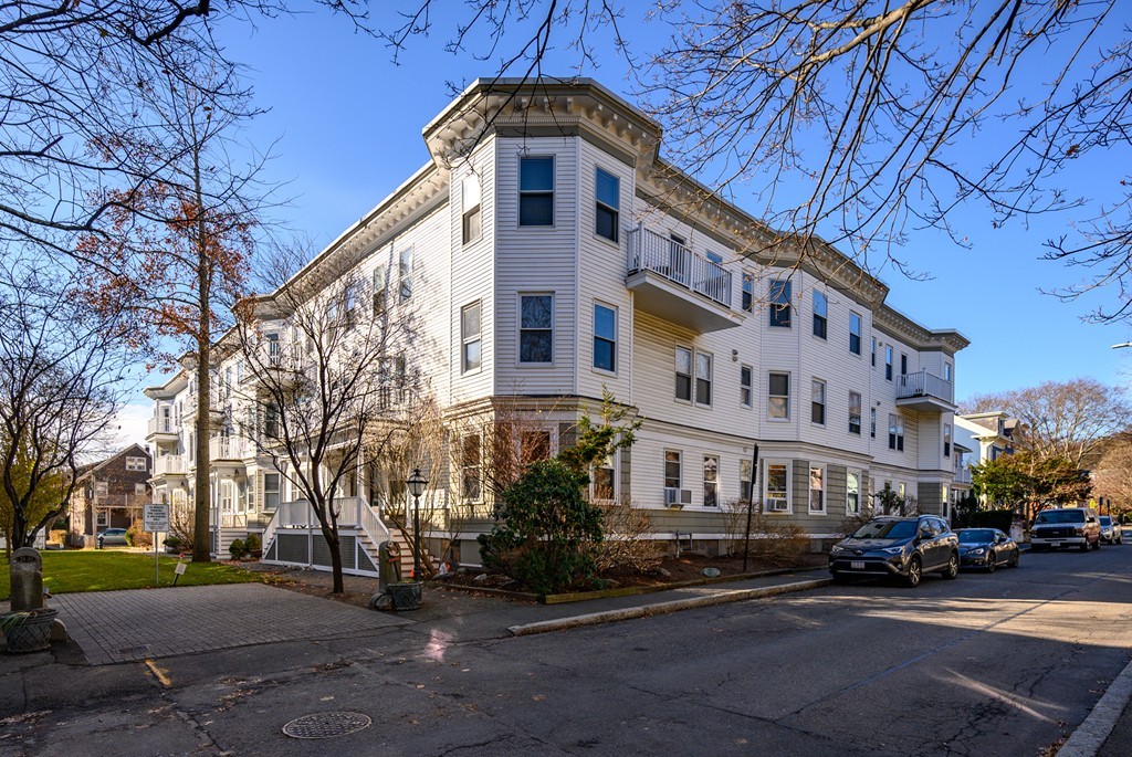 36 Stanton Road, Unit 1 Brookline, MA 02445 - Photo 1 of 17 a city street lined with buildings and cars