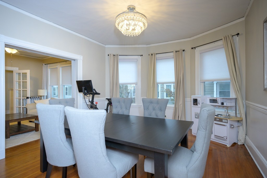 36 Stanton Road, Unit 1 Brookline, MA 02445 - Photo 11 of 17 a view of a dining room with furniture window and wooden floor