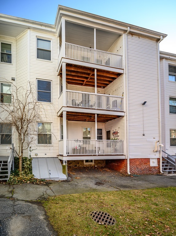 36 Stanton Road, Unit 1 Brookline, MA 02445 - Photo 17 of 17 a front view of a house with a yard