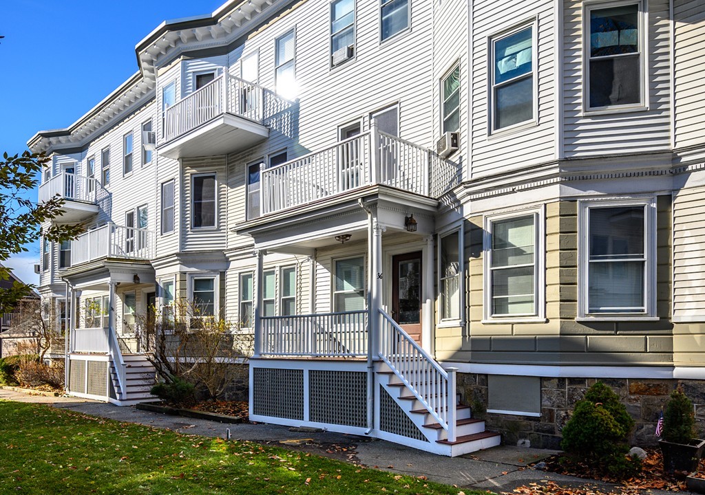 36 Stanton Road, Unit 1 Brookline, MA 02445 - Photo 2 of 17 a front view of a house with a yard