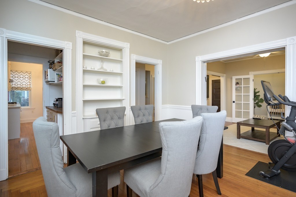36 Stanton Road, Unit 1 Brookline, MA 02445 - Photo 10 of 17 a view of a dining room with furniture and wooden floor
