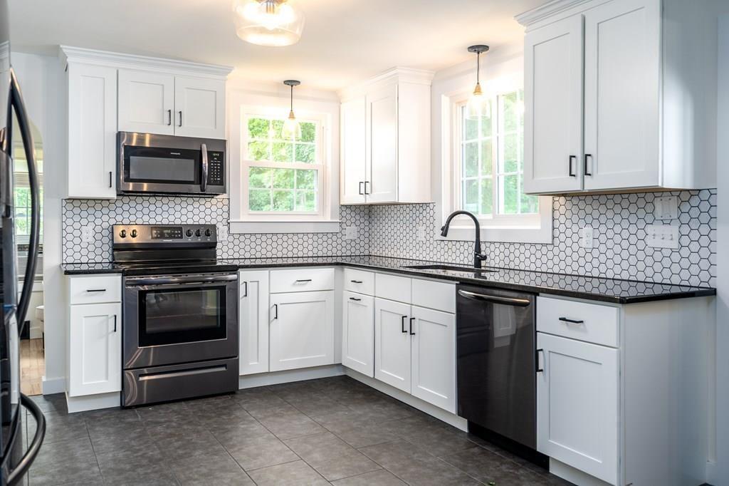 4 Fomer Road Southampton, MA 01073 - Photo 11 of 42 a kitchen with stainless steel appliances granite countertop a stove a sink and a microwave
