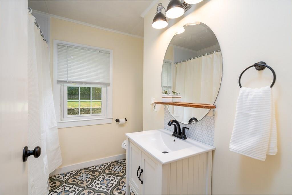 4 Fomer Road Southampton, MA 01073 - Photo 24 of 42 a bathroom with a sink and a mirror
