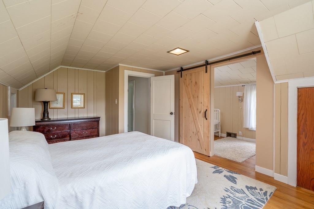 4 Fomer Road Southampton, MA 01073 - Photo 27 of 42 a bedroom with a bed and a mirror