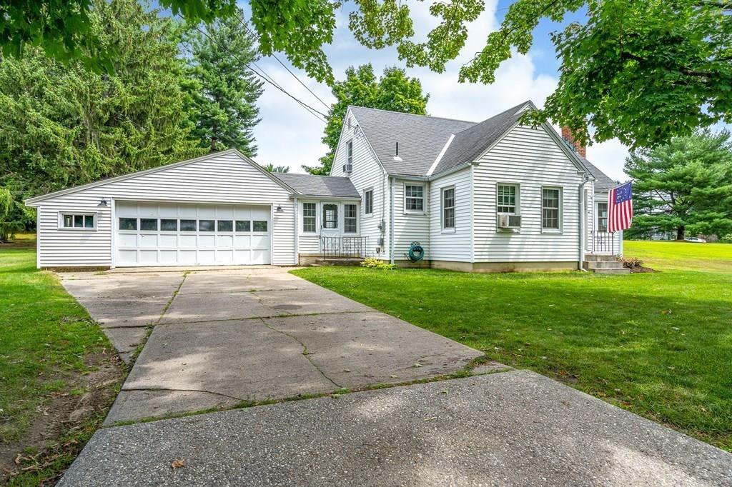 4 Fomer Road Southampton, MA 01073 - Photo 6 of 42 a front view of a house with a yard and garage