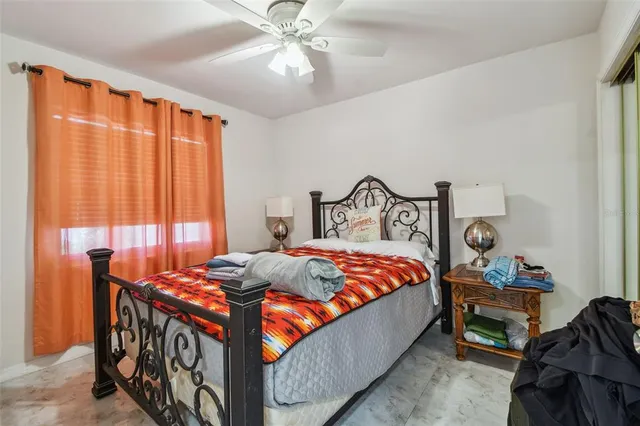 a view of a chair and table in backyard of the house