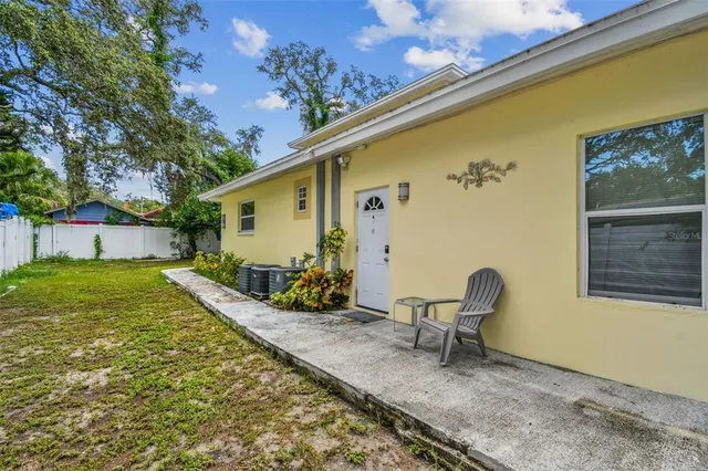 a kitchen with stainless steel appliances granite countertop white cabinets a stove a refrigerator and a microwave