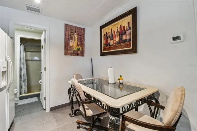 a bedroom with two beds and a table