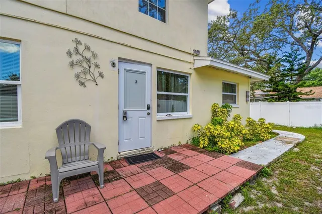 a view of a dining room with furniture and a kitchen