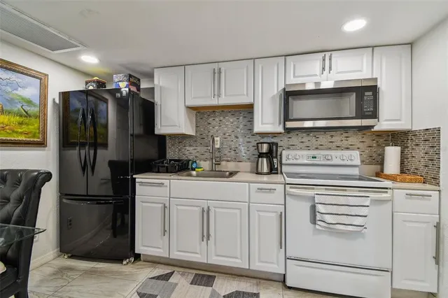 a bathroom with a toilet a sink and shower