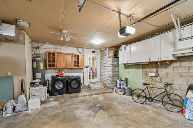 a spacious bedroom with a bed and a window