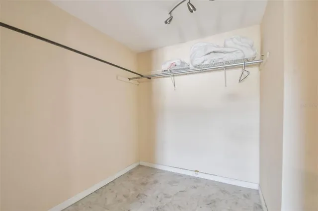 a swimming pool with trees in the background