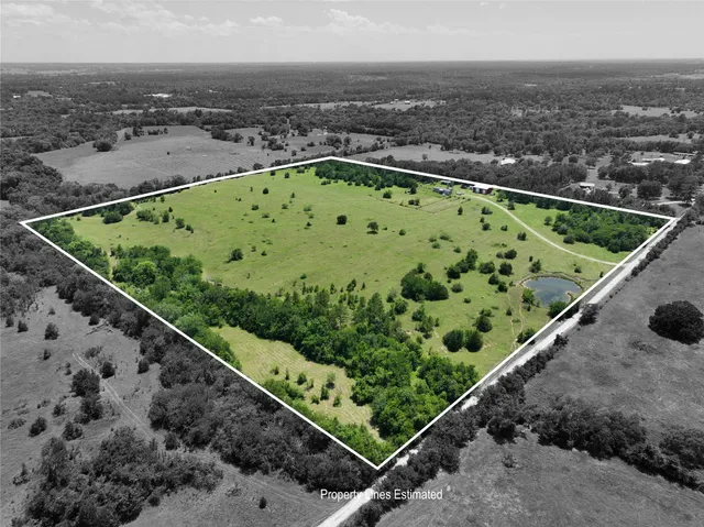 a view of a pool with a yard