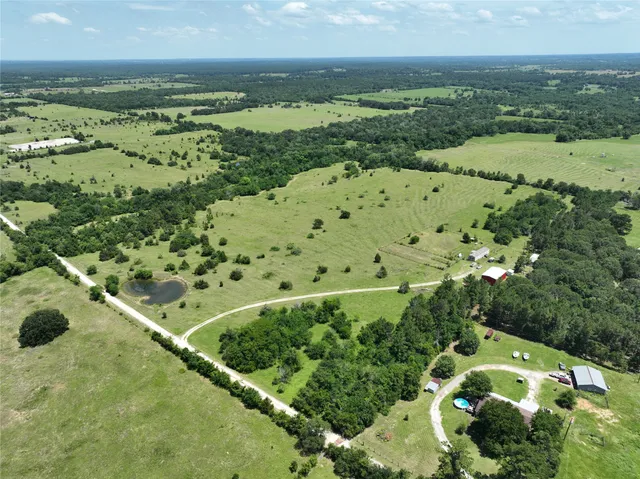 a view of a field with an ocean