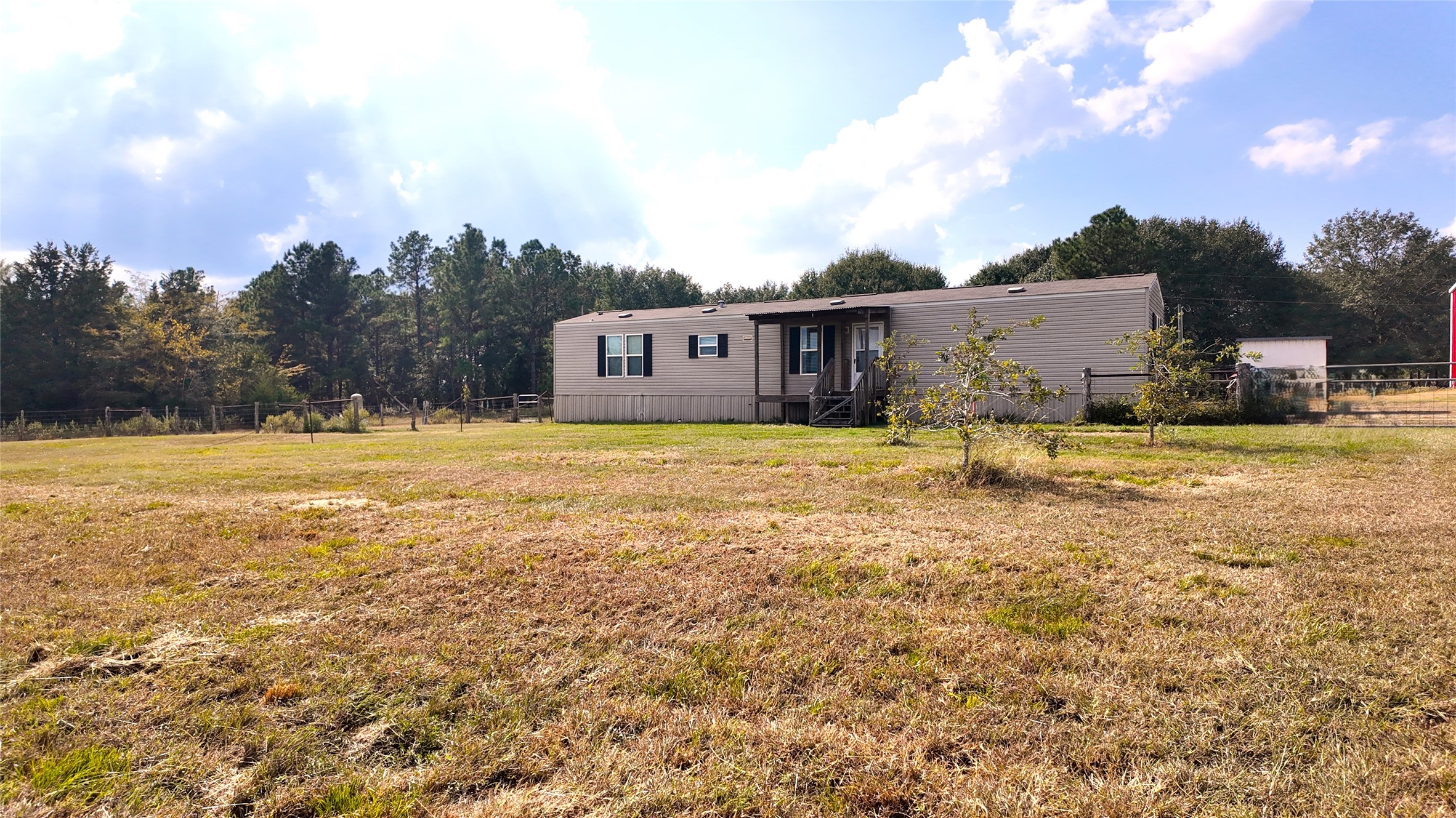 2974 County Road 213 Anderson, TX 77830 - Photo 18 of 50 a view of a house with a yard