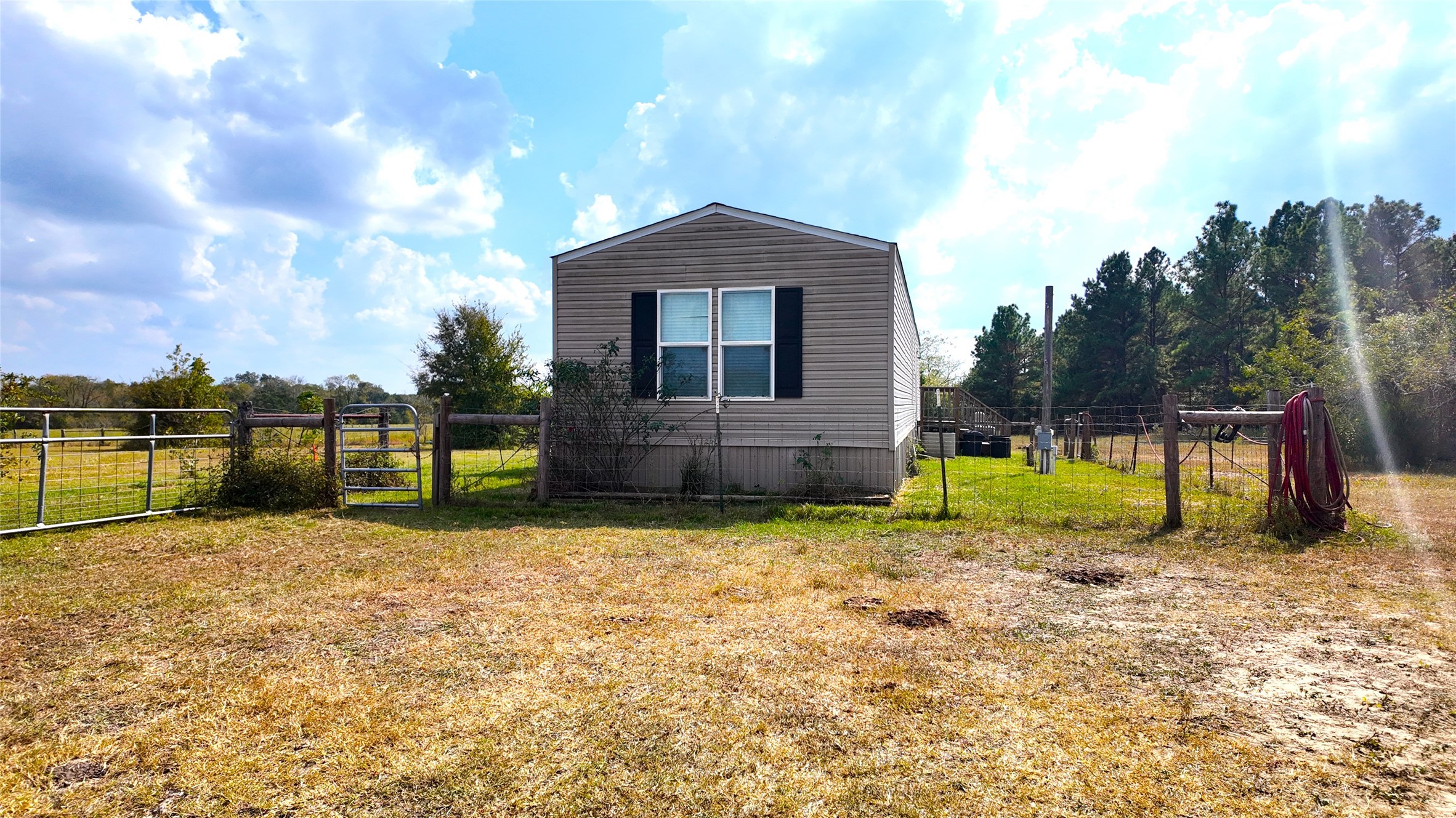 2974 County Road 213 Anderson, TX 77830 - Photo 19 of 50 a view of a house with a yard