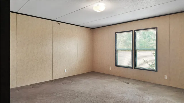 a view of an empty room with windows