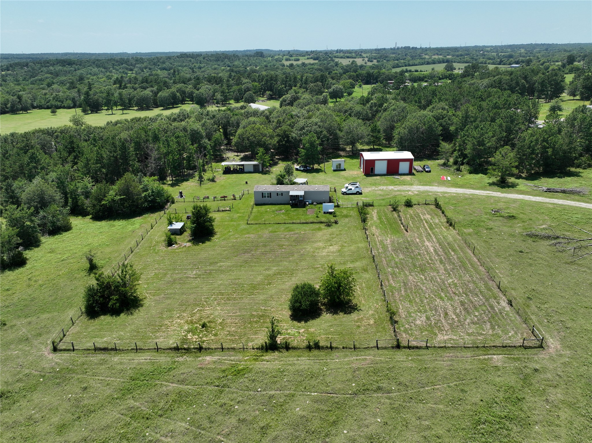 2974 County Road 213 Anderson, TX 77830 - Photo 3 of 50 a garden with trees in the background