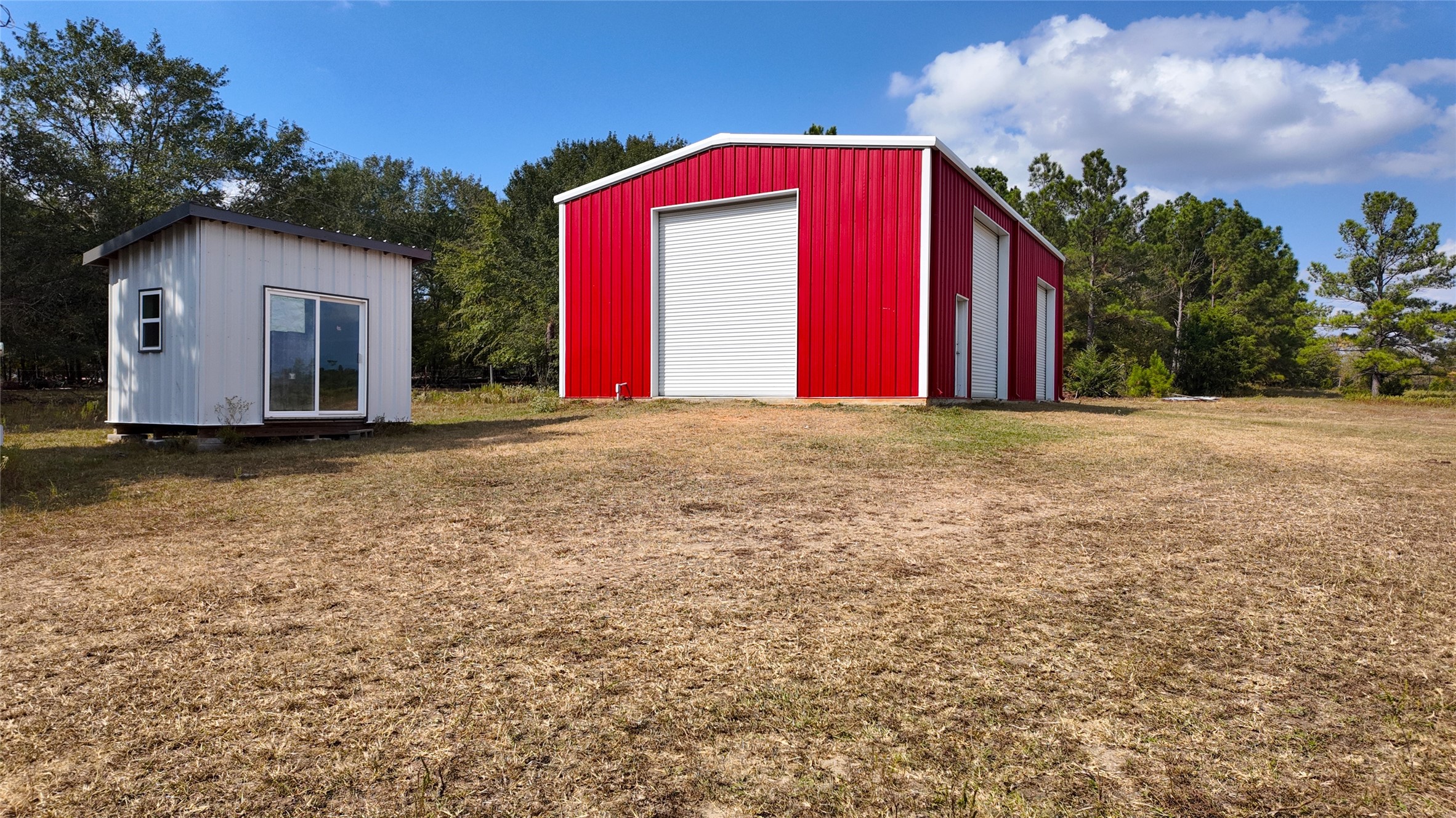 2974 County Road 213 Anderson, TX 77830 - Photo 43 of 50 a view of a house with a yard and garage