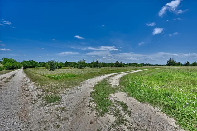 a view of a lake with a yard