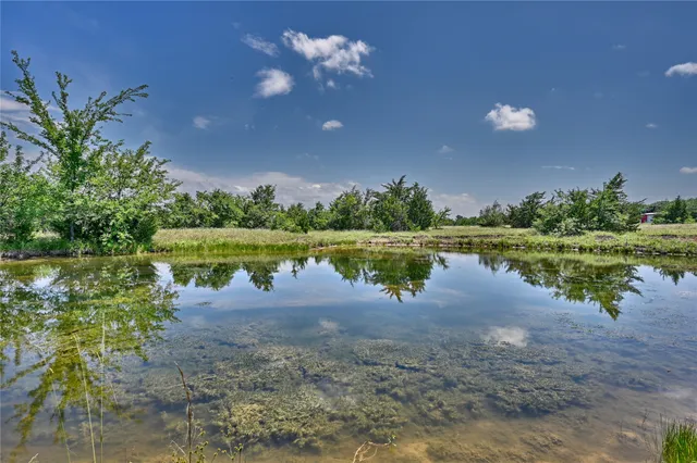 a view of a lake with a big yard