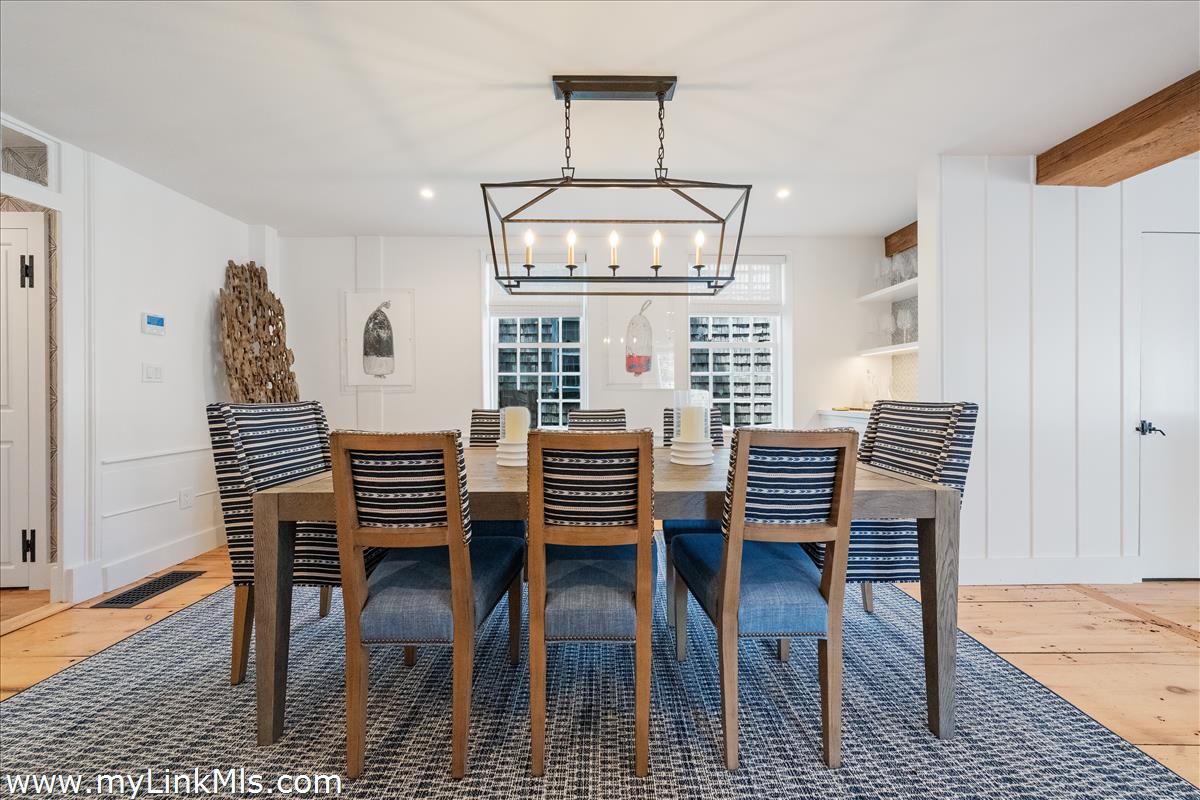10 North Water Street Nantucket, MA 02554 - Photo 17 of 78 a view of a dining room with furniture window and wooden floor