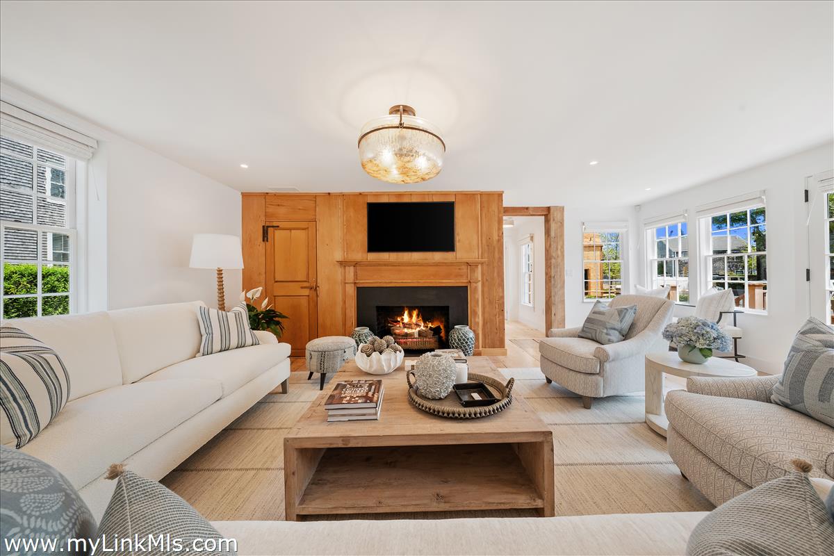 10 North Water Street Nantucket, MA 02554 - Photo 20 of 78 a living room with furniture a fireplace and a flat screen tv