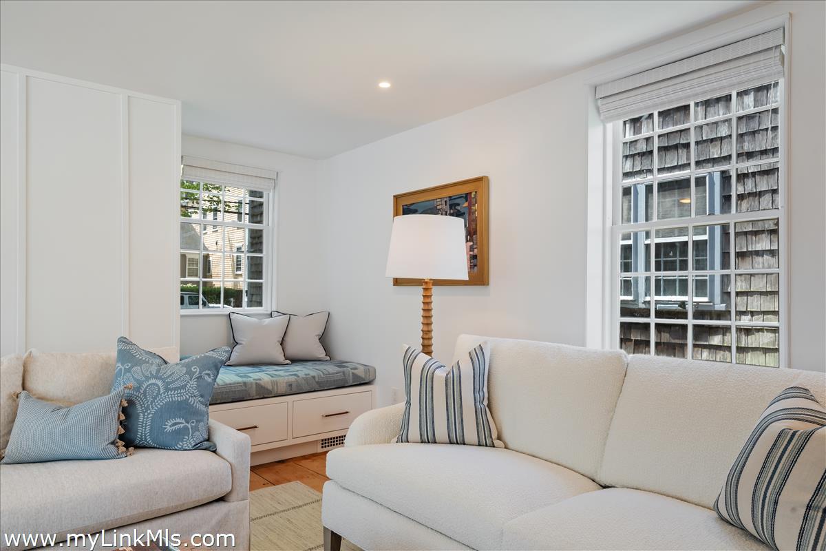 10 North Water Street Nantucket, MA 02554 - Photo 22 of 78 a living room with furniture and a window