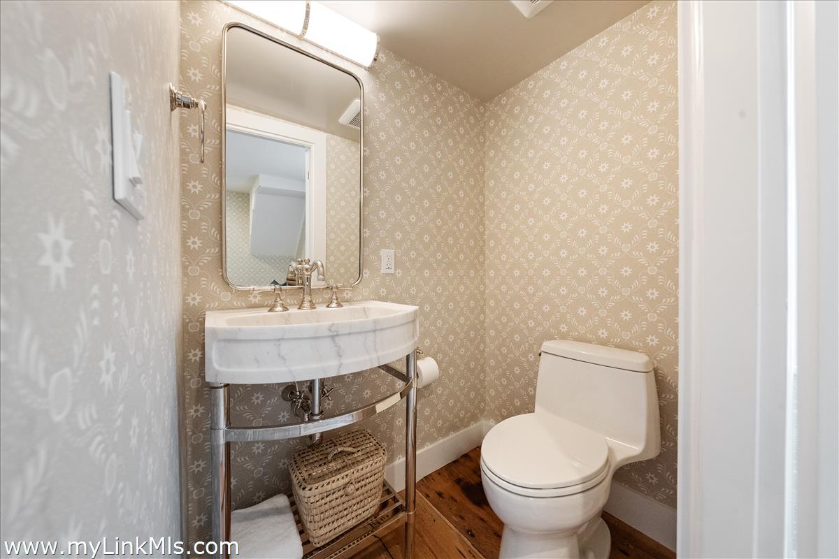 10 North Water Street Nantucket, MA 02554 - Photo 33 of 78 a bathroom with a toilet a sink and a mirror