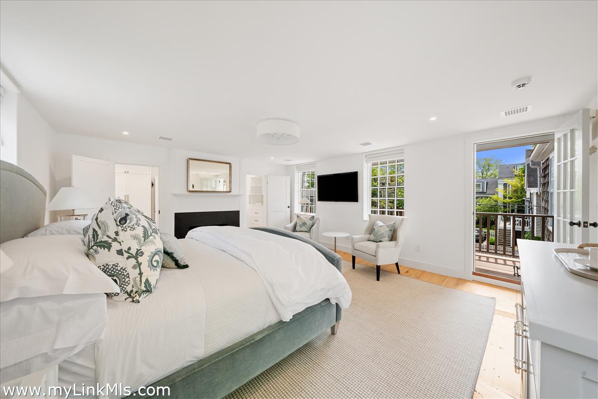 10 North Water Street Nantucket, MA 02554 - Photo 37 of 78 a large bedroom with a bed and large windows