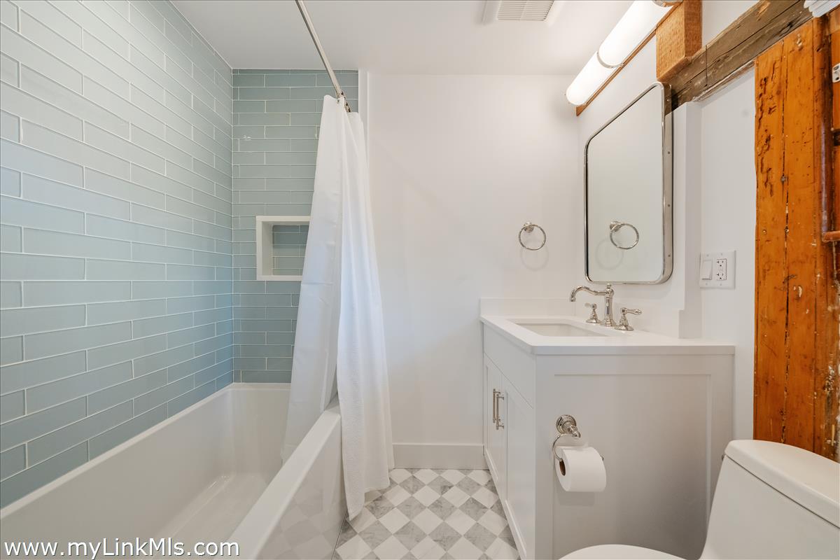 10 North Water Street Nantucket, MA 02554 - Photo 54 of 78 a bathroom with a sink a toilet and shower