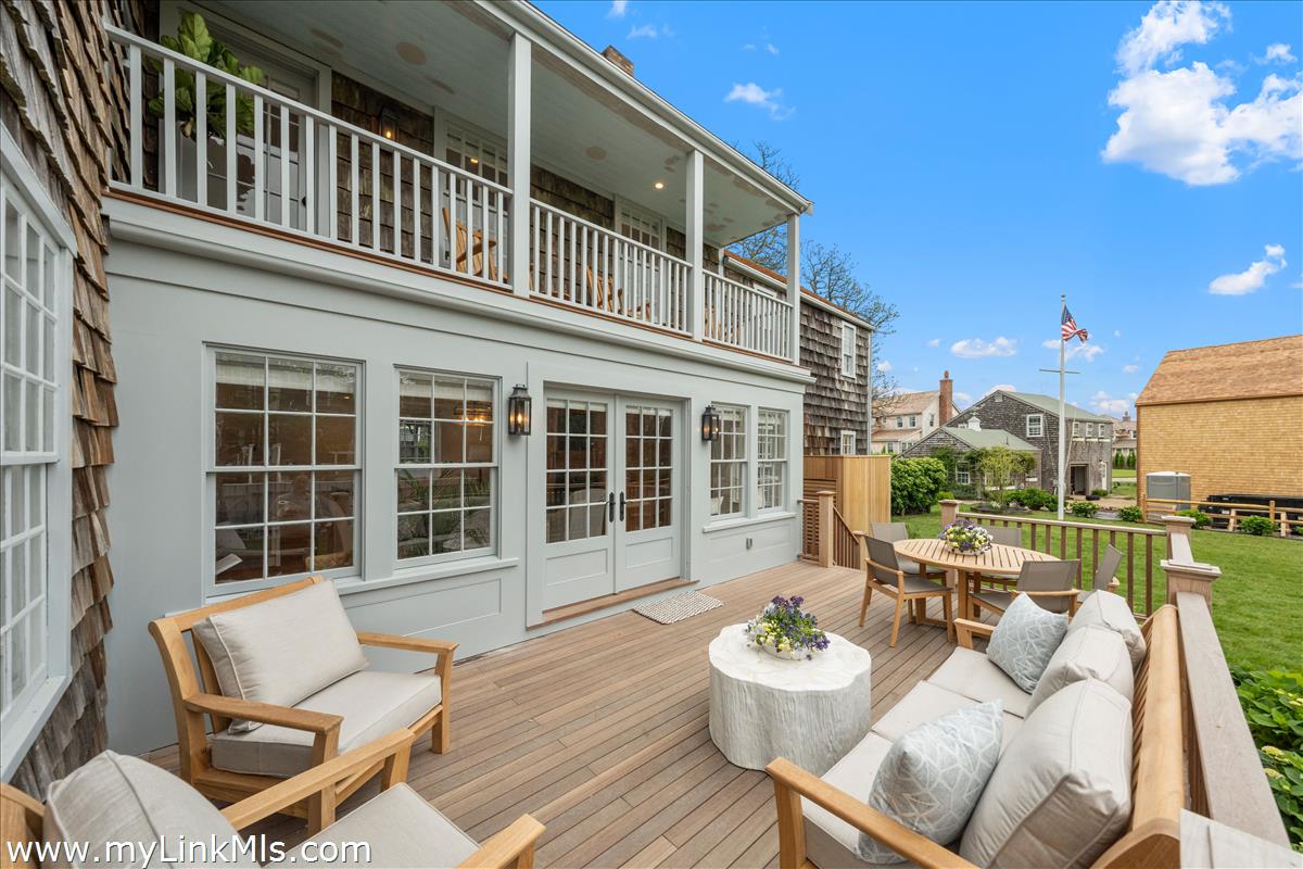 10 North Water Street Nantucket, MA 02554 - Photo 65 of 78 a view of a patio with couches table and chairs and potted plants