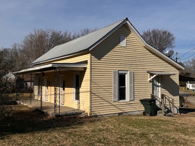 139 Columbia Avenue Centerville, TN 37033 - Photo 15 of 44 a front view of a house with a yard