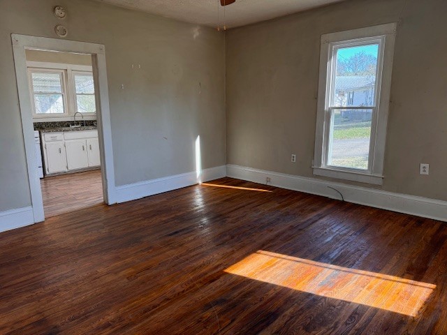 139 Columbia Avenue Centerville, TN 37033 - Photo 20 of 44 an empty room with wooden floor cabinet and windows
