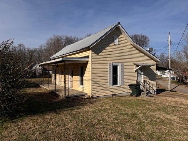 139 Columbia Avenue Centerville, TN 37033 - Photo 2 of 44 a front view of a house with a yard