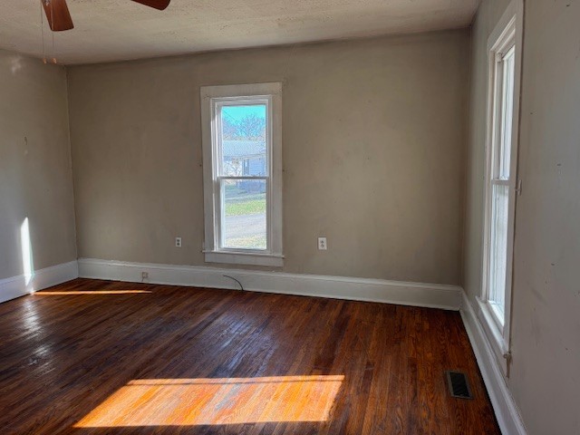 139 Columbia Avenue Centerville, TN 37033 - Photo 21 of 44 a view of an empty room with wooden floor and a window