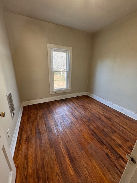 139 Columbia Avenue Centerville, TN 37033 - Photo 32 of 44 an empty room with wooden floor and windows