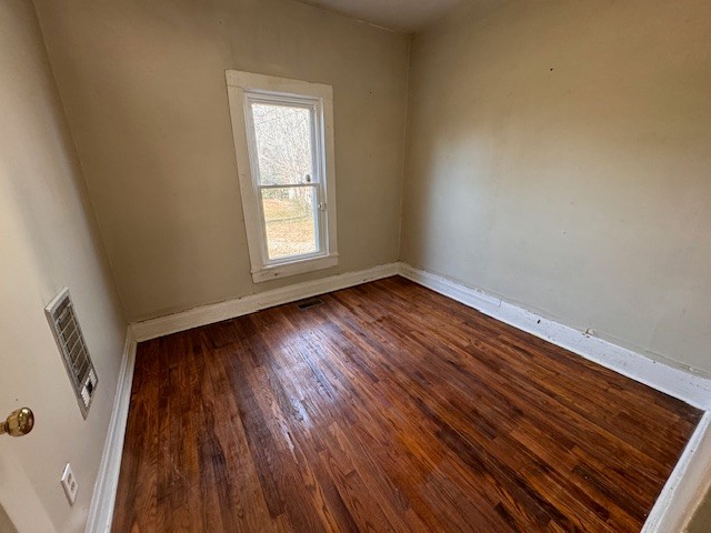 139 Columbia Avenue Centerville, TN 37033 - Photo 33 of 44 a view of an empty room with wooden floor and a window