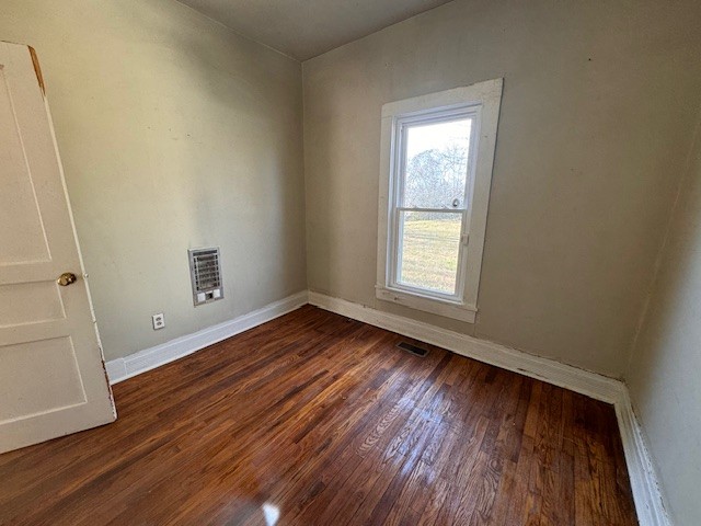 139 Columbia Avenue Centerville, TN 37033 - Photo 34 of 44 an empty room with wooden floor and windows