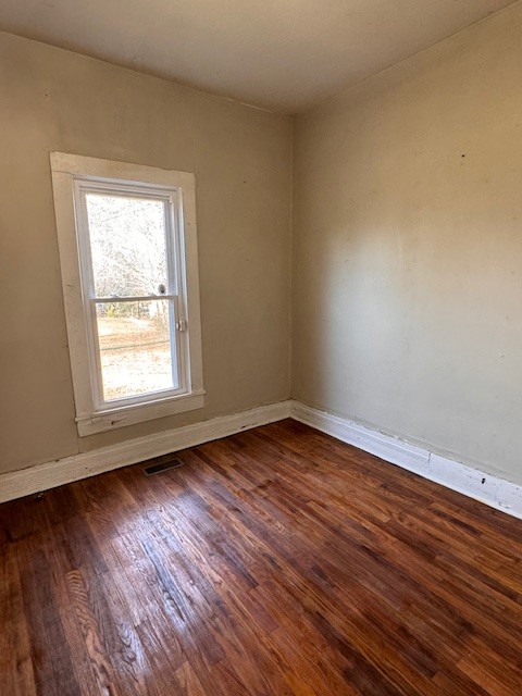 139 Columbia Avenue Centerville, TN 37033 - Photo 37 of 44 a view of an empty room with wooden floor and a window
