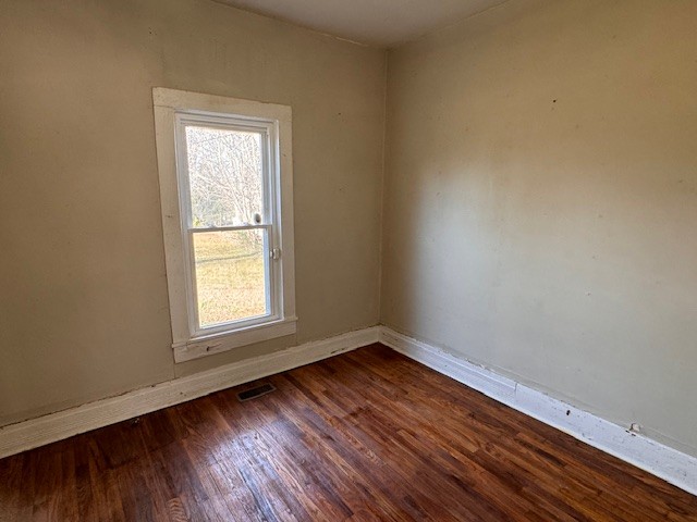 139 Columbia Avenue Centerville, TN 37033 - Photo 38 of 44 an empty room with wooden floor and windows