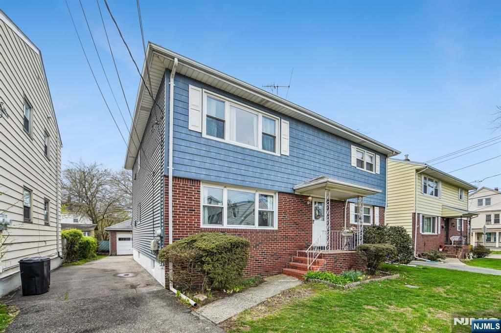 31 Division Street Bloomfield, NJ 07003 - Photo 1 of 30 a front view of a house with a yard