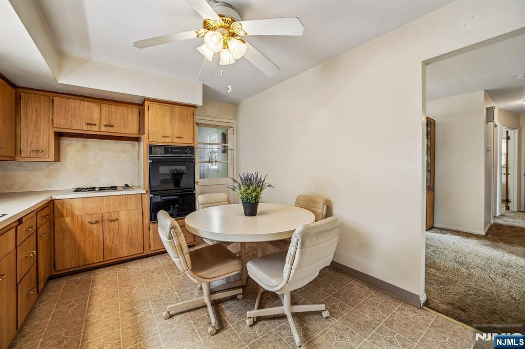 31 Division Street Bloomfield, NJ 07003 - Photo 12 of 30 a dining room with furniture and chandelier