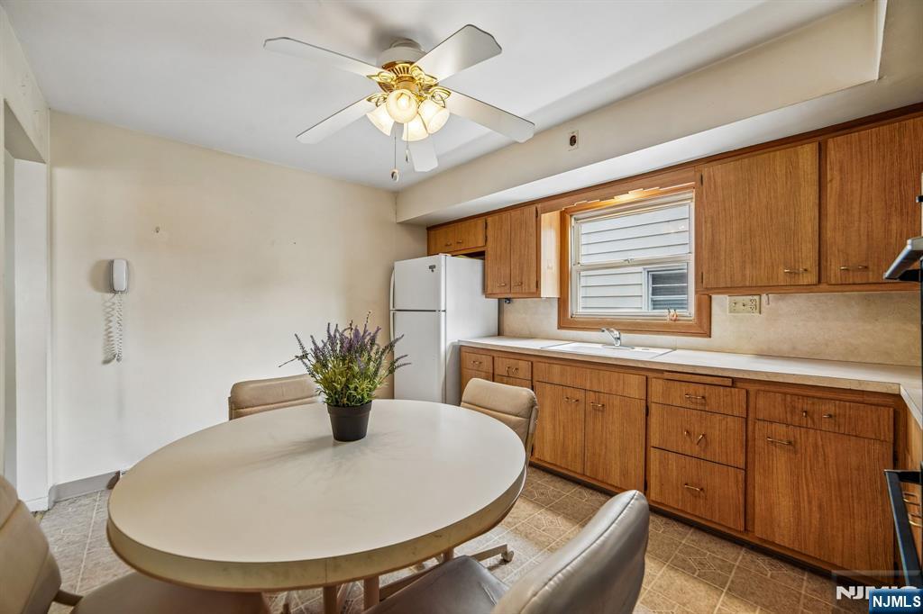 31 Division Street Bloomfield, NJ 07003 - Photo 14 of 30 a kitchen with a table and a sink