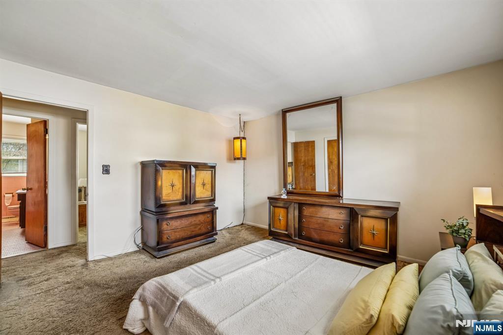 31 Division Street Bloomfield, NJ 07003 - Photo 20 of 30 a bedroom with a bed and a television in it